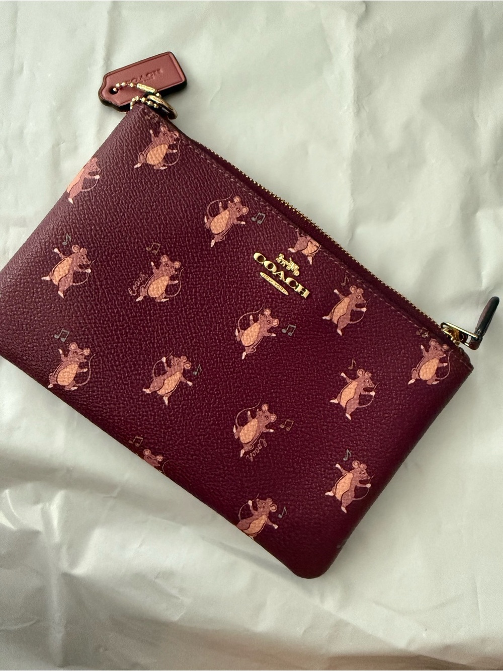 COACH Burgundy Printed Leather Wristlet Pouch with Pink Accent Motif